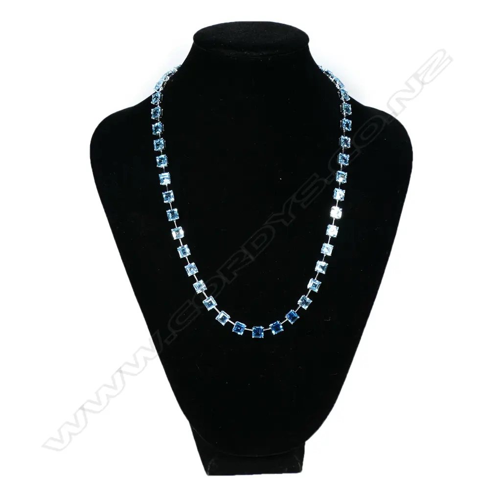 A 9ct white gold and blue topaz necklace, Image 1++