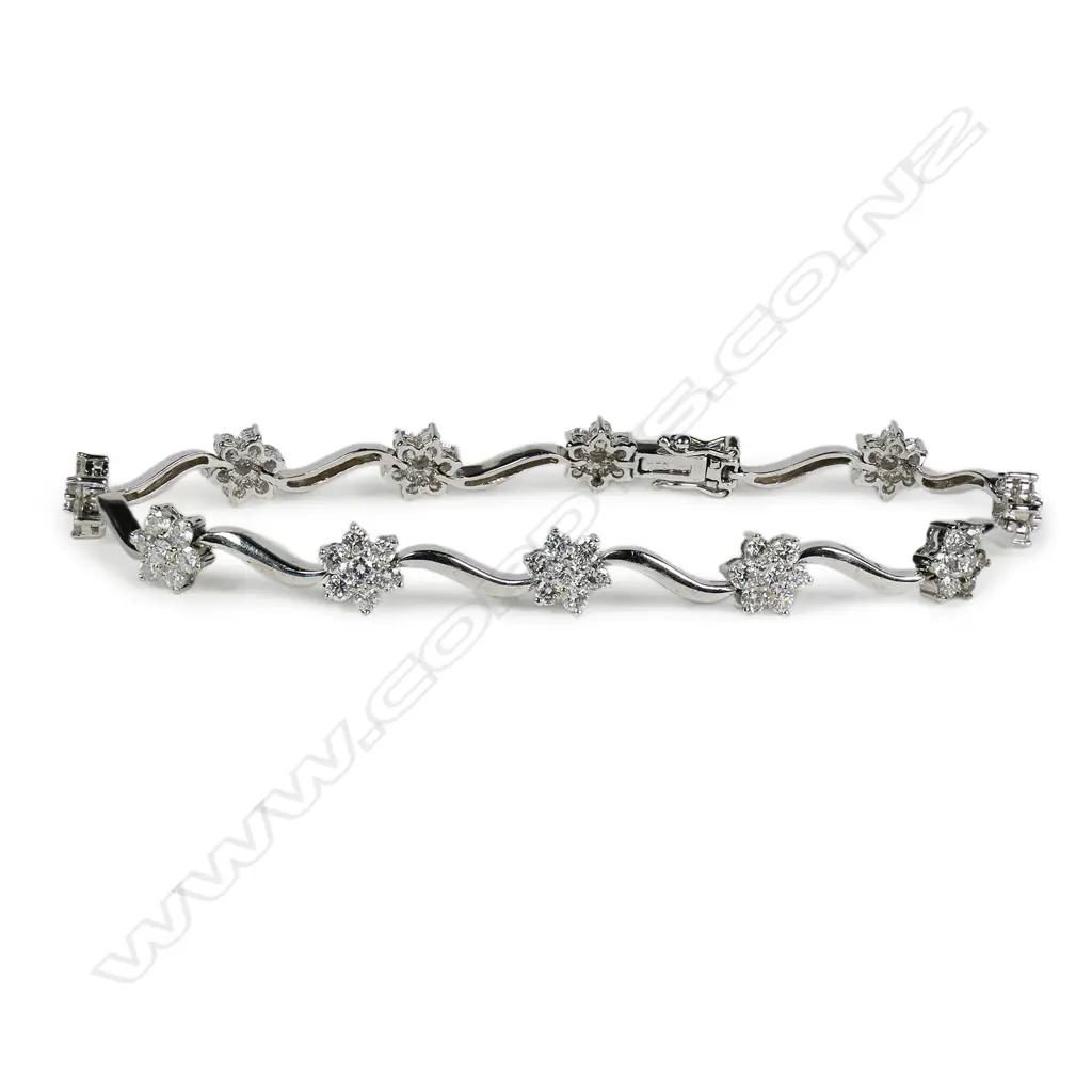 An 18ct white gold and diamond bracelet, Image 1++