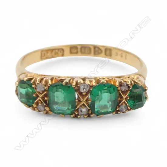 An Edwardian 18ct yellow gold emerald and diamond bridge ring,