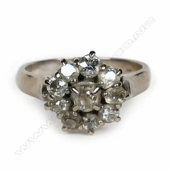 An old 18ct white gold and diamond cluster ring,