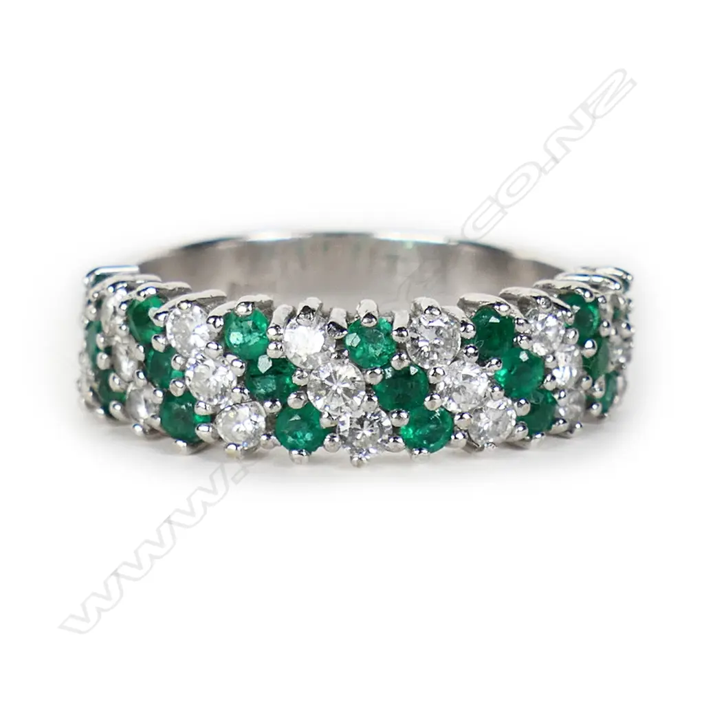 An 18ct white gold emerald and diamond dress ring, Image 1++