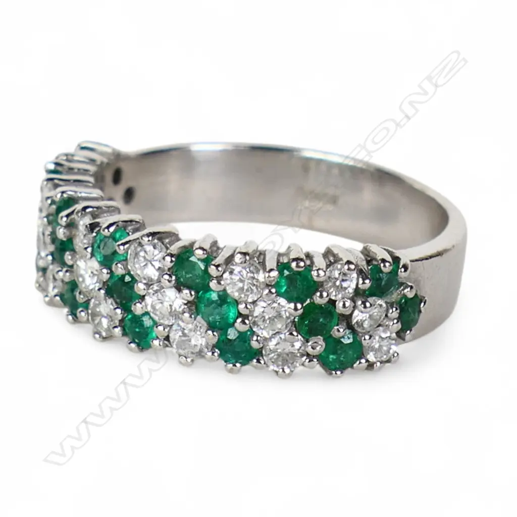 An 18ct white gold emerald and diamond dress ring, Image 1++