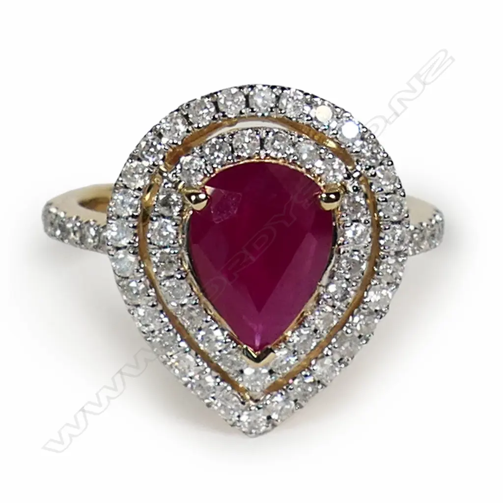 A 14ct gold ruby and diamond double halo ring, Image 1++