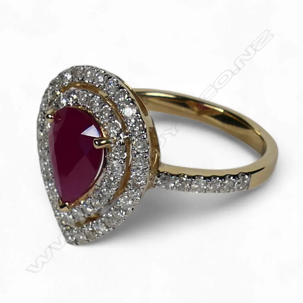 A 14ct gold ruby and diamond double halo ring, Image 1++