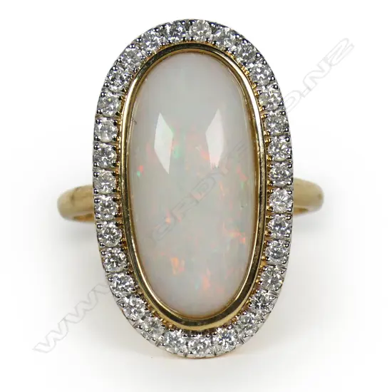 A 14ct gold opal and diamond halo ring,
