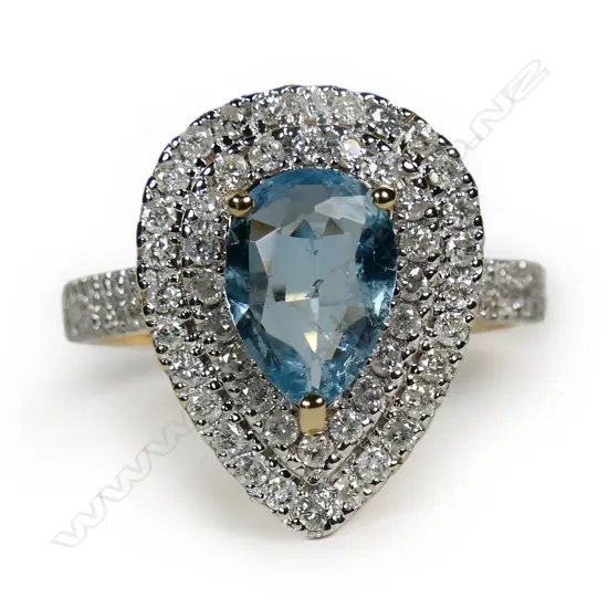 A 14ct gold aquamarine and diamond double halo ring,