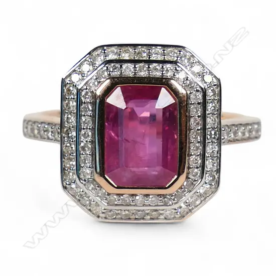 A 14ct rose gold ruby and diamond double halo ring,