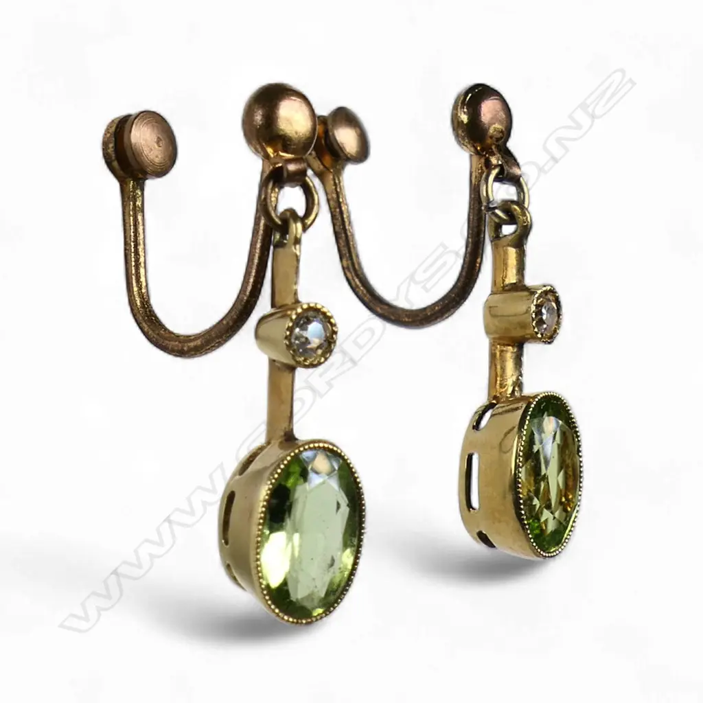 A pair of Edwardian 15ct gold peridot and diamond drop earrings, Image 1++