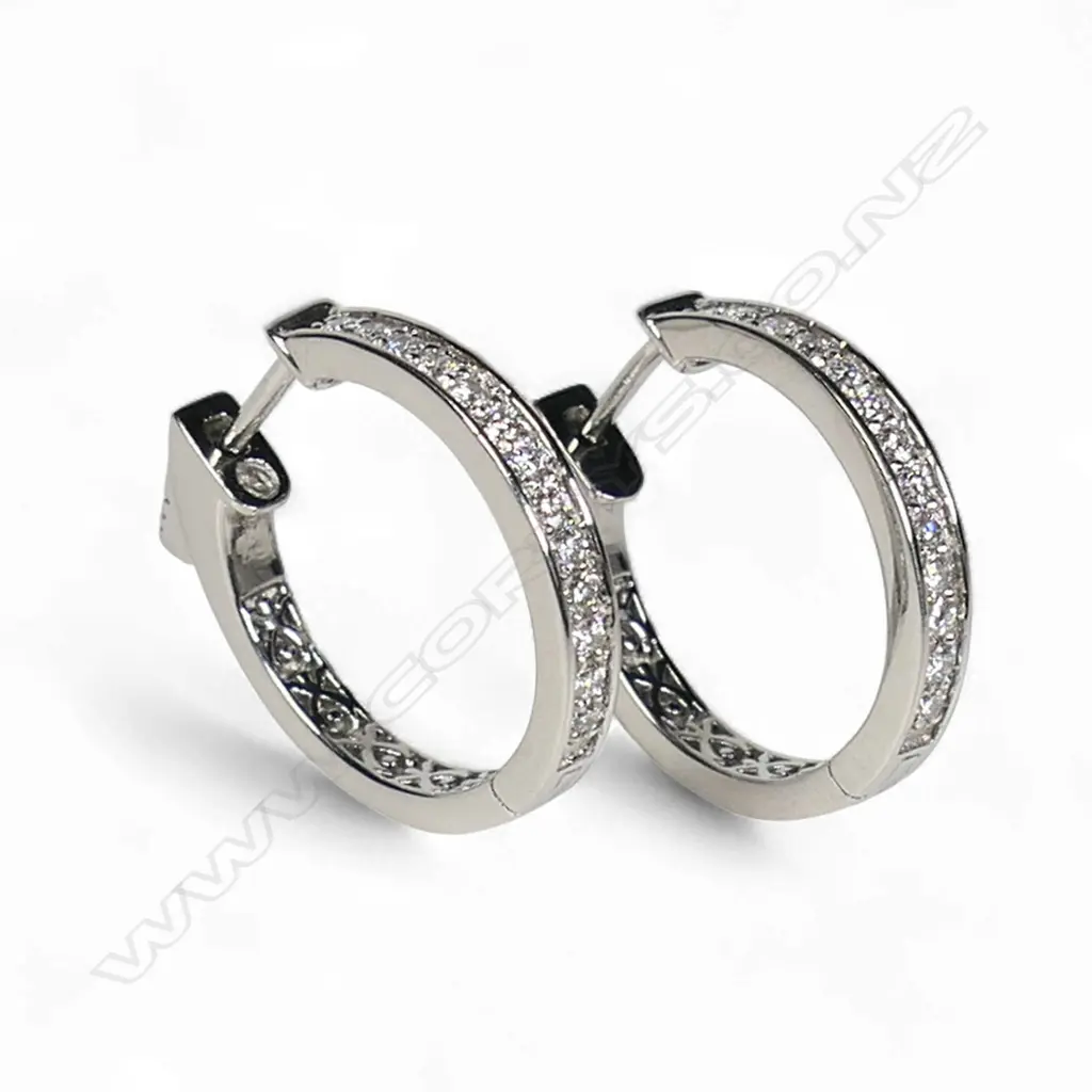 A pair of platinum and diamond hoop earrings, Image 1++