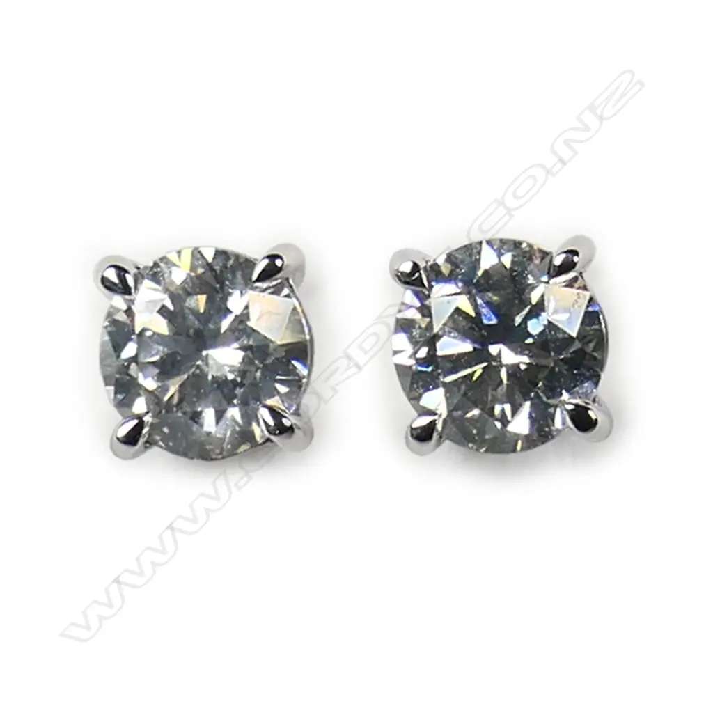 A pair of 14ct white gold and diamond stud earrings, Image 1++