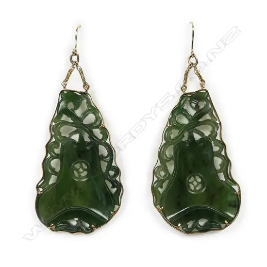 A pair of vintage 18ct yellow gold framed and large carved dark jade earrings,