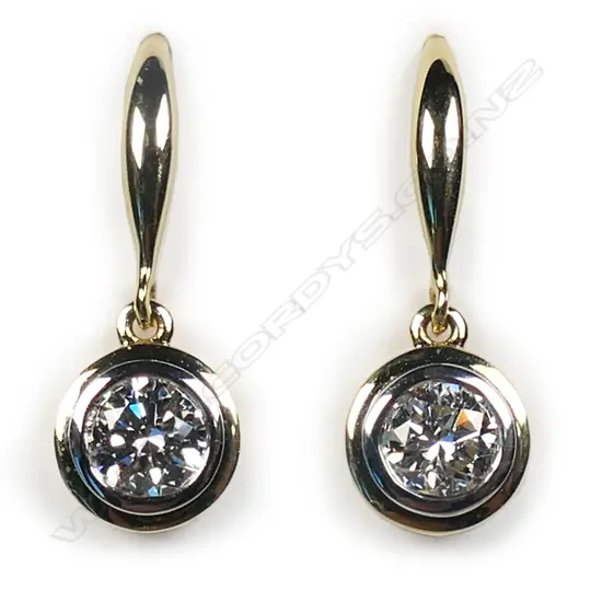 A pair of 18ct yellow gold and diamond solitaire earrings,