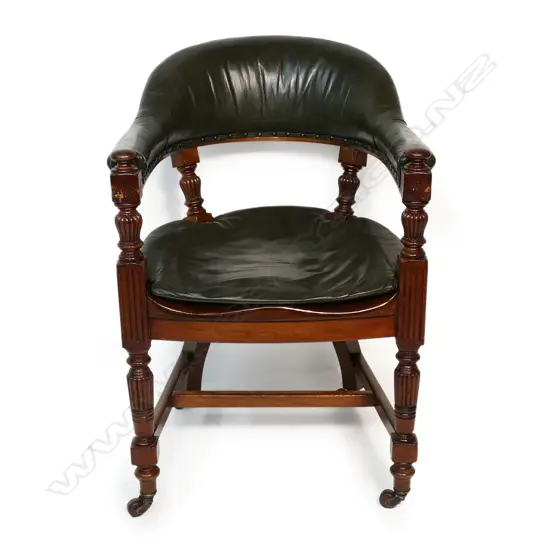 A Victorian mahogany and leather desk chair,