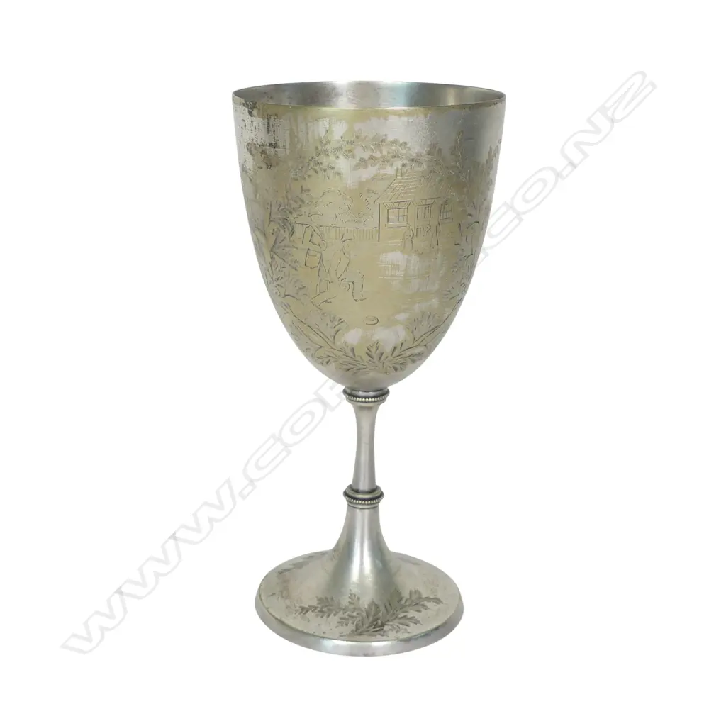 A late 19thC New Zealand historical silver plate trophy cup, presentation engraved ' Dunedin Bowling Club Rink Match 1887 Won By James Anderson. The front engraved with a bowling scene. The plating worn. H.210mm. Image 1++