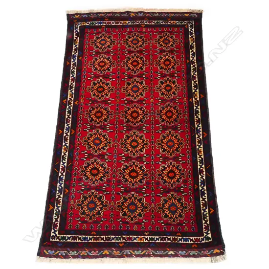 A hand-knotted Baluchi rug,