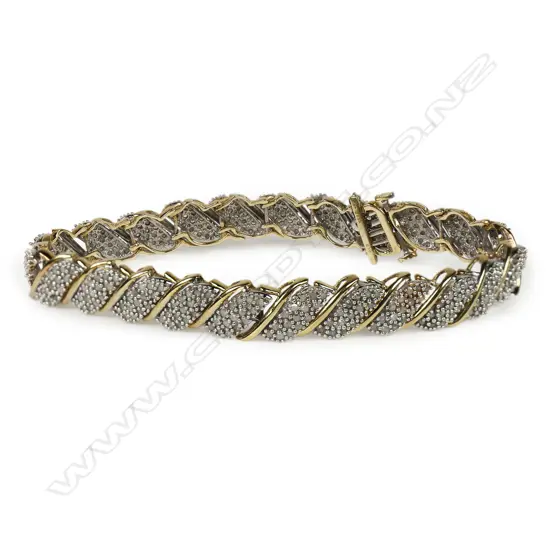 A 10ct gold and diamond cuff bracelet,