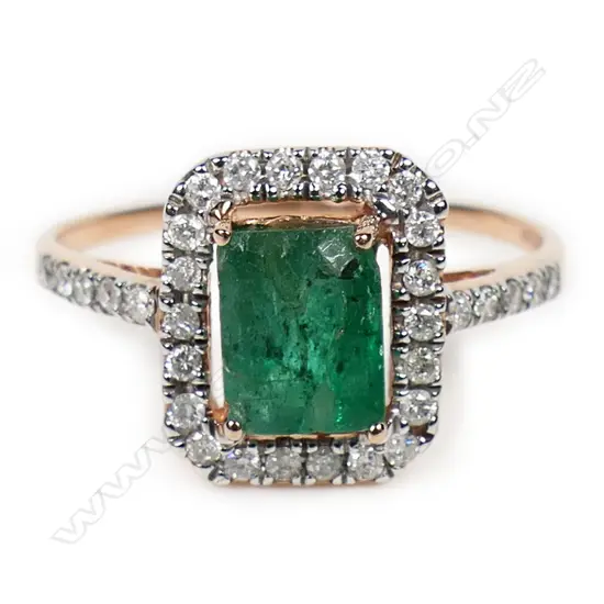 A 10ct rose gold emerald and diamond halo ring,