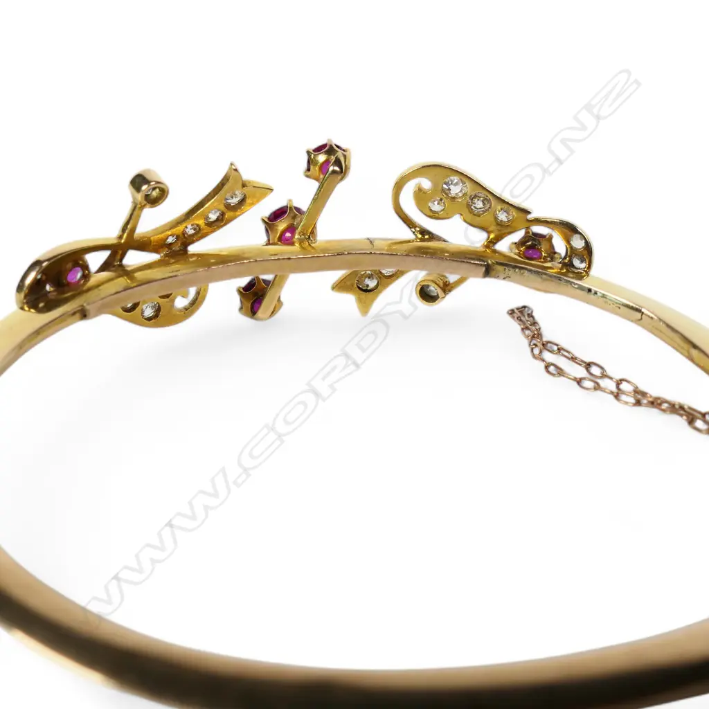 An early 1900s 18ct gold ruby and diamond snap bangle, Image 1++
