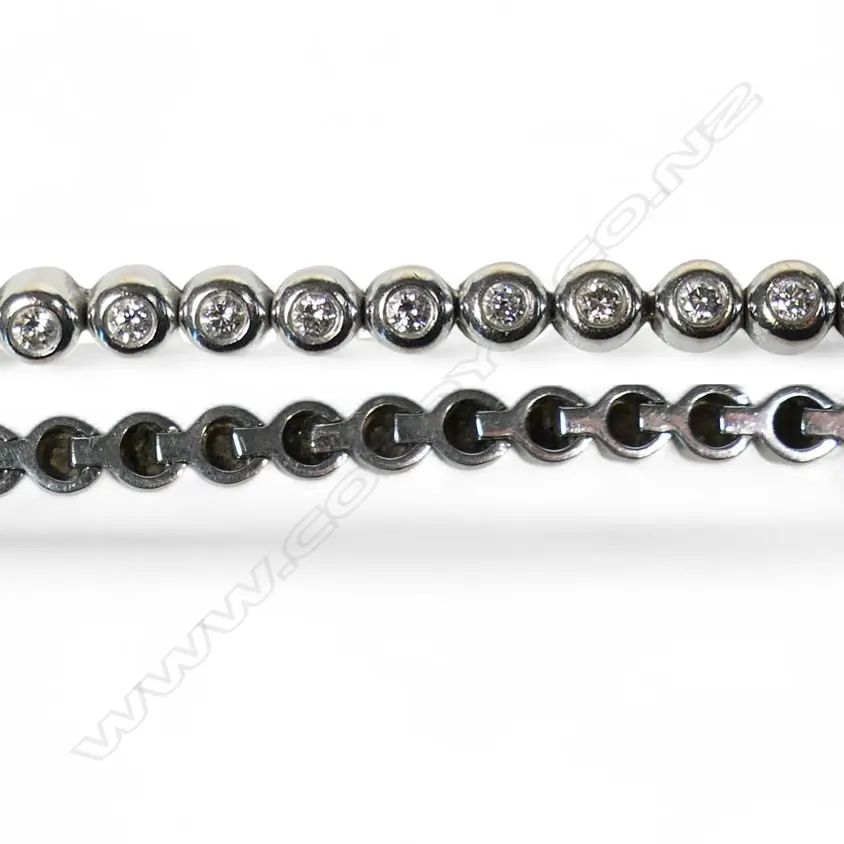 An 18ct white gold and diamond line bracelet, Image 1++