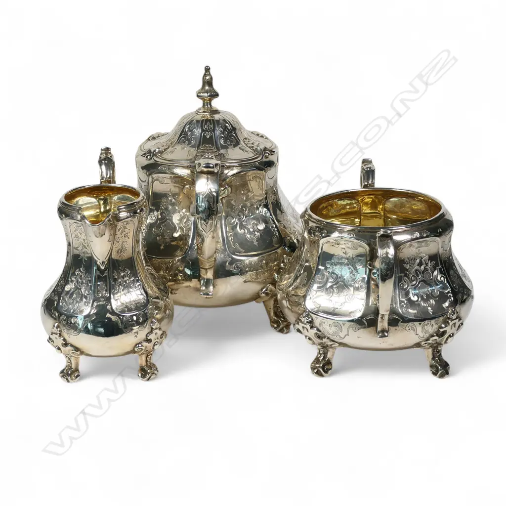 A fancy Victorian silver three-piece tea service, Image 1++