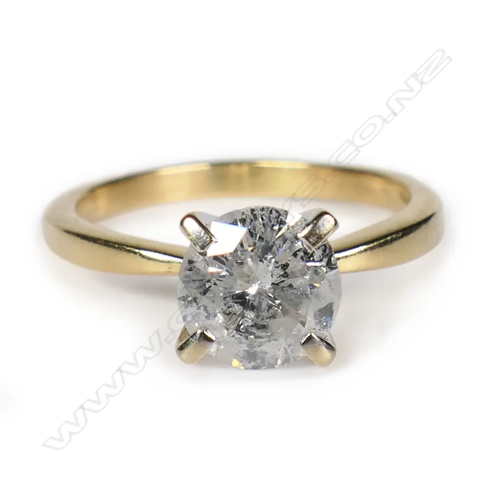 An 18ct gold and diamond solitaire ring, Image 1++