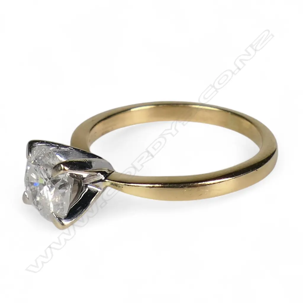 An 18ct gold and diamond solitaire ring, Image 1++