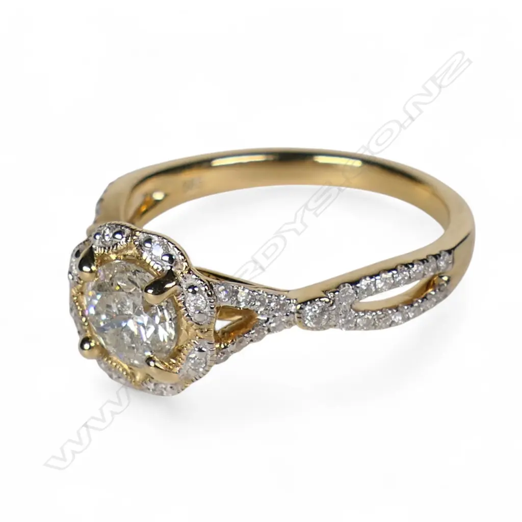 A 14ct gold and diamond halo dress ring, Image 1++