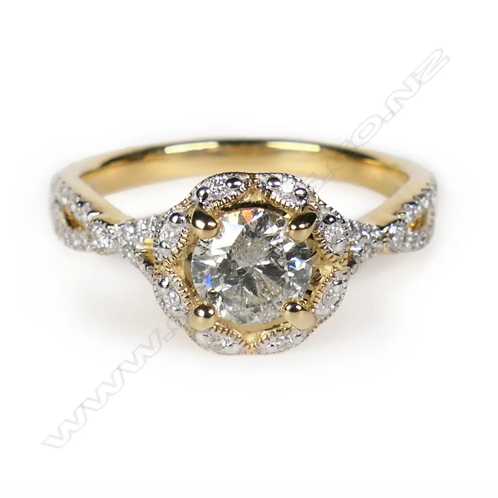 A 14ct gold and diamond halo dress ring, Image 1++