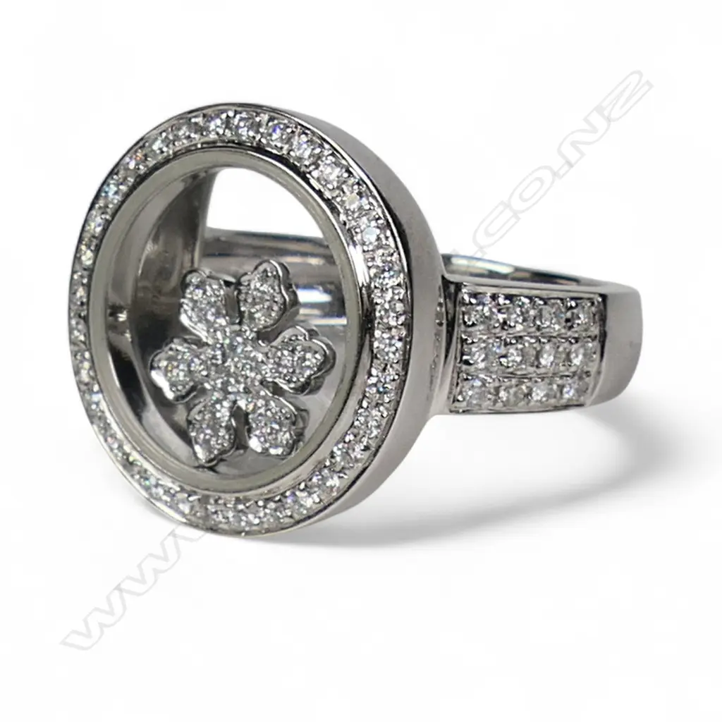 An 18ct white gold and diamond dress ring, Image 1++