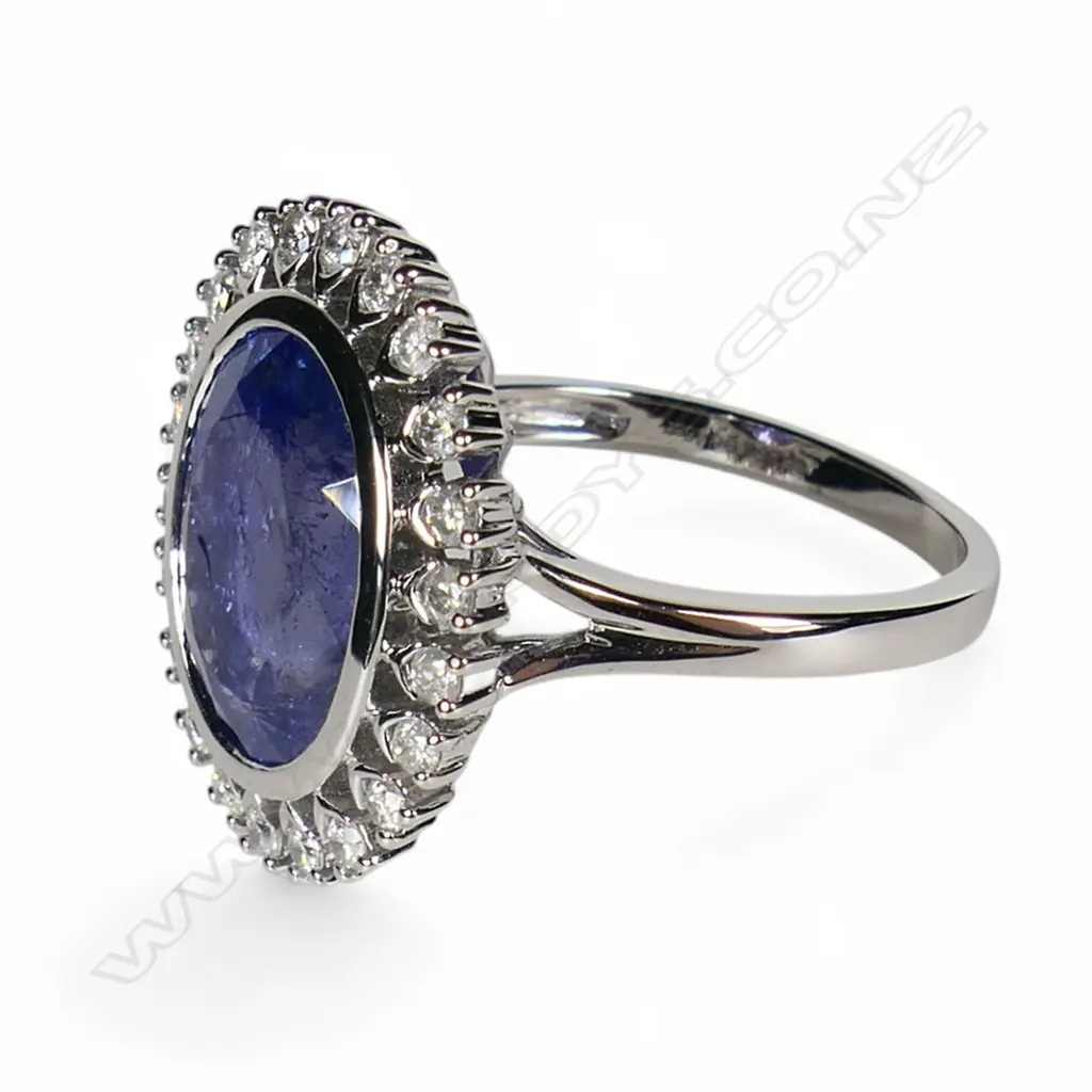 A 14ct white gold tanzanite and diamond halo ring, Image 1++