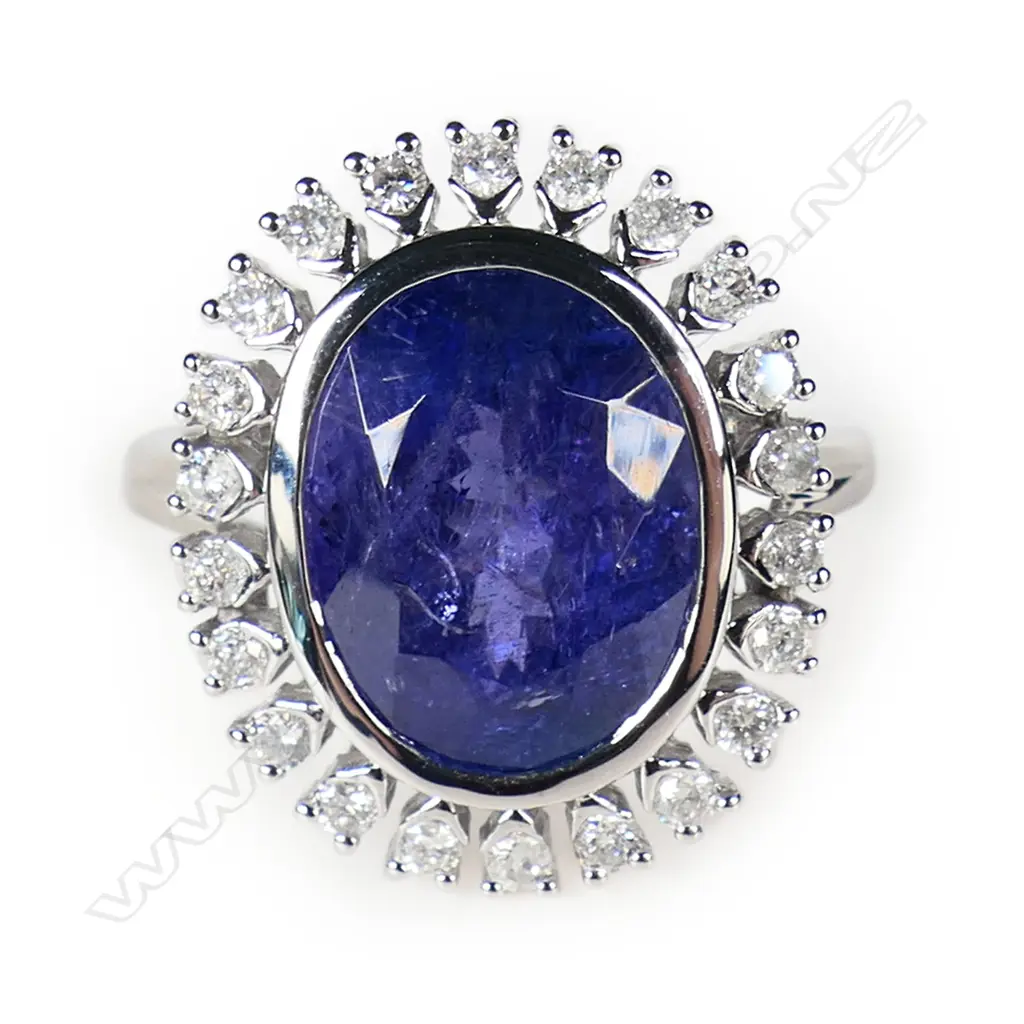 A 14ct white gold tanzanite and diamond halo ring, Image 1++