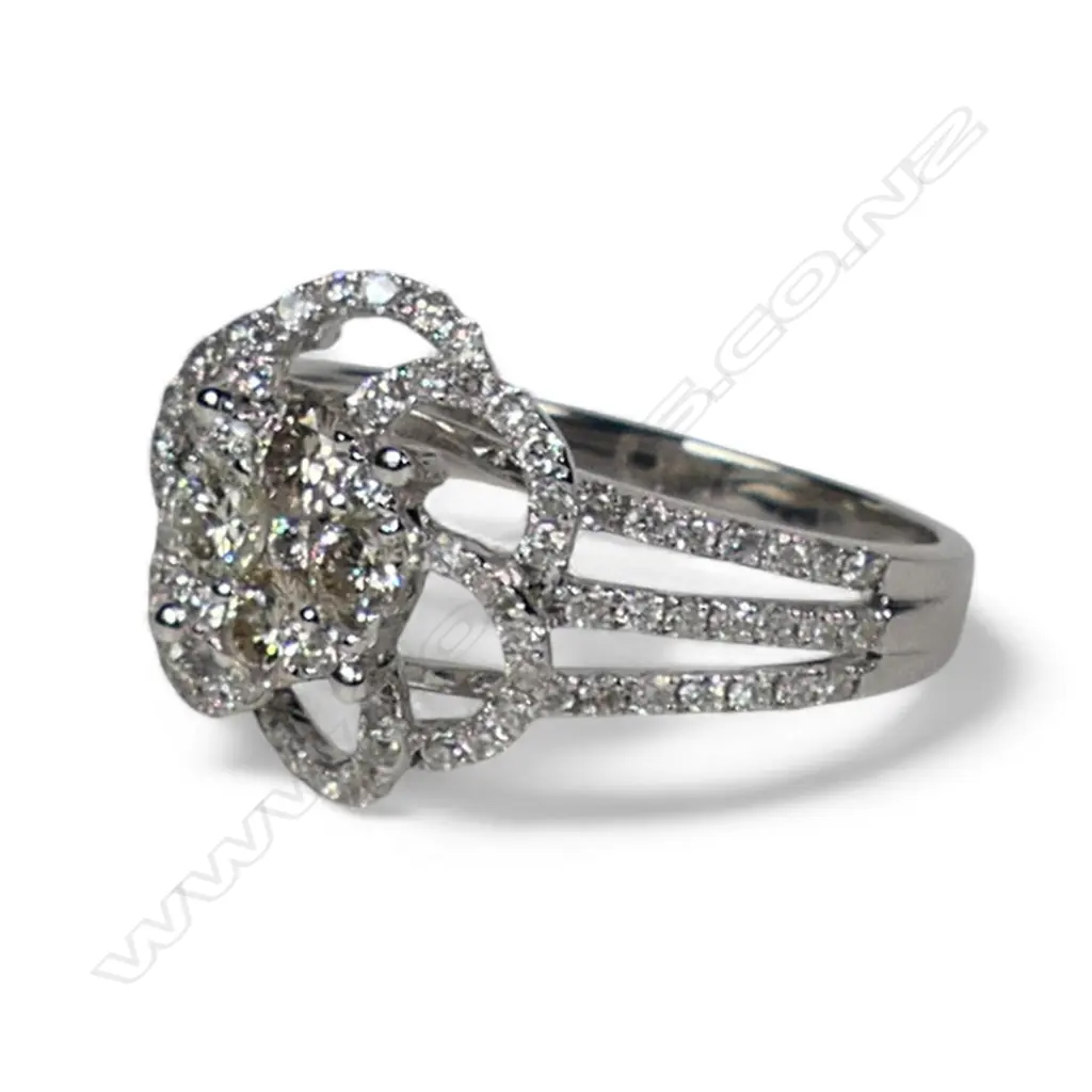 An 18ct white gold and diamond cluster ring, Image 1++