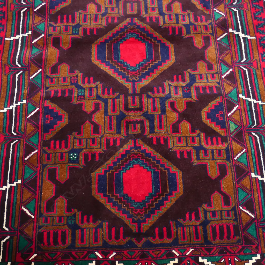 A hand knotted Baloch rug, Image 1++