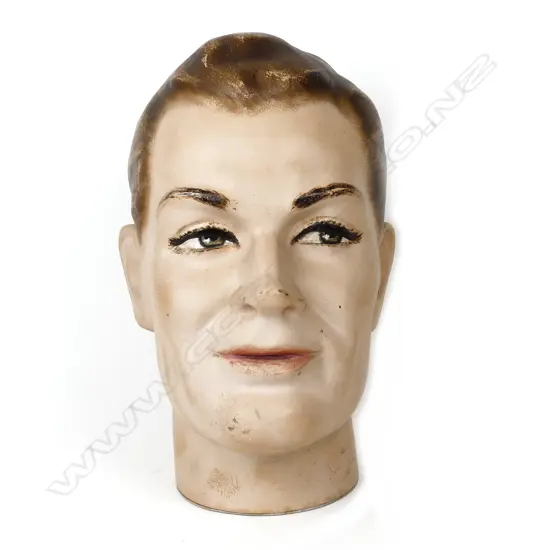 A vintage white male mannequin head