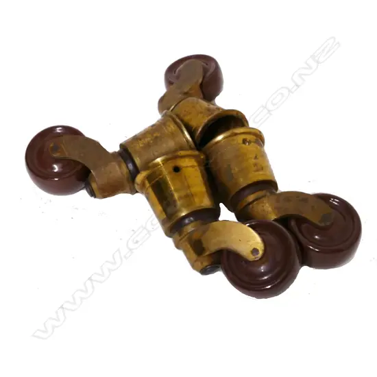 Four large brown ceramic table casters
