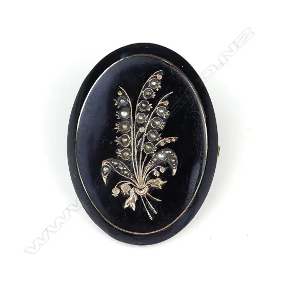 A Victorian oval mourning brooch