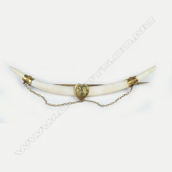 A late 19thC tusk brooch