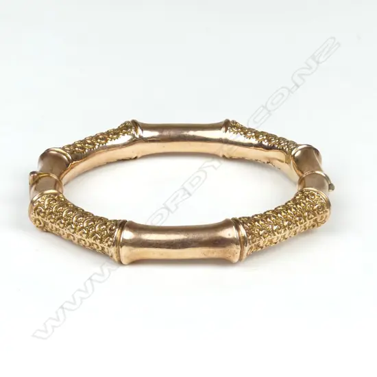 A 9ct rose gold half hinged bangle
