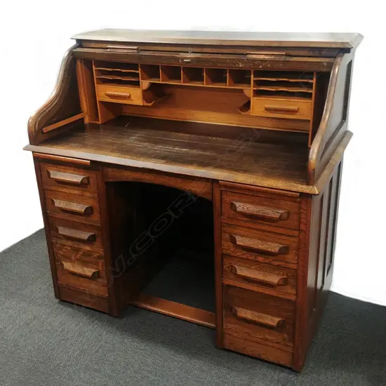 An oak roll top desk