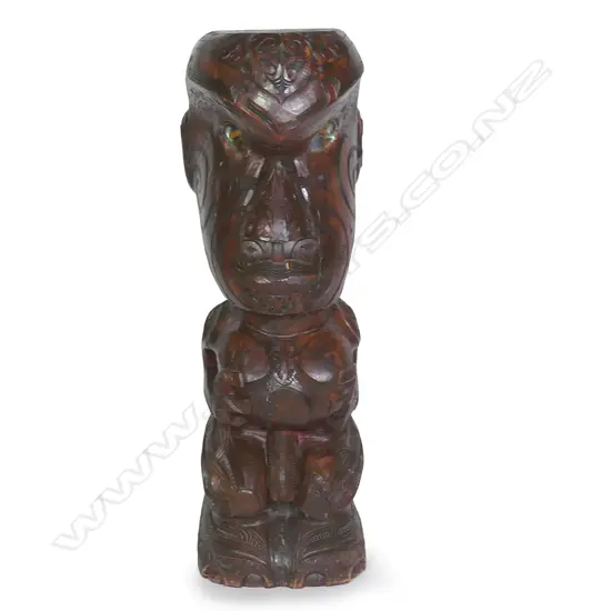A large and impressive Maori stylised carved figural post