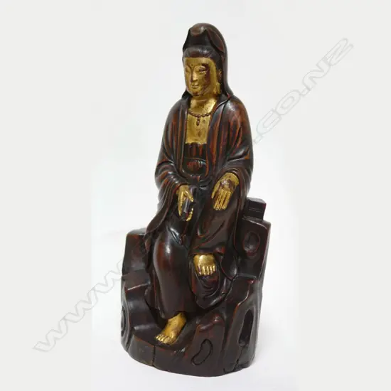 An old Chinese carved hardwood figure of Kuanyin