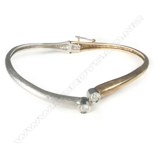 A 9ct white and yellow gold diamond hinged bangle