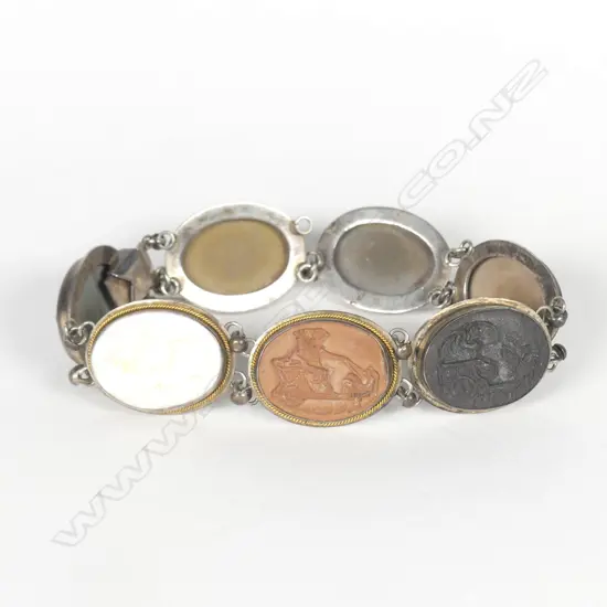 An early 20thC silver framed carved lava cameo bracelet