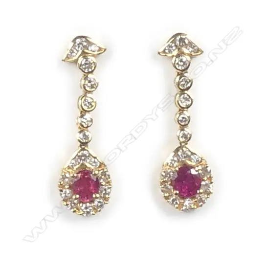 An 18ct. yellow gold ruby and diamond pair of drop earrings