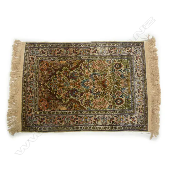 A hand knotted silk wall rug