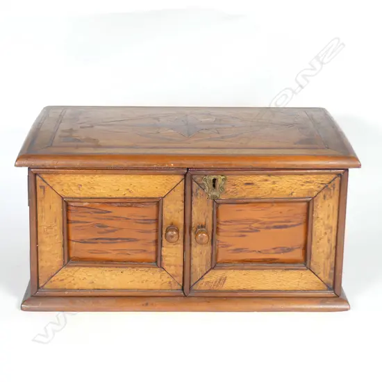 A N.Z colonial woods attributed Jewell & Co. jewellery box. the lid with an eight-point star within a diamond panel