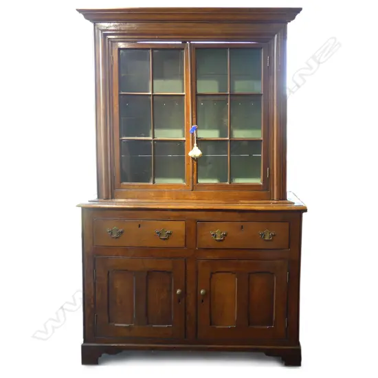 An antique oak bookcase chiffonier
