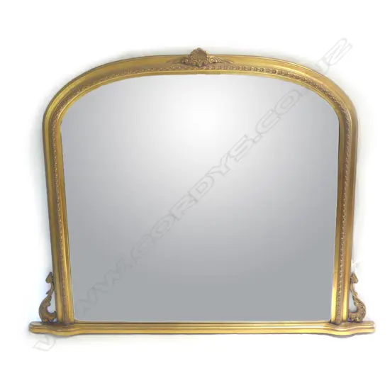An antique style gilt framed overmantel mirror