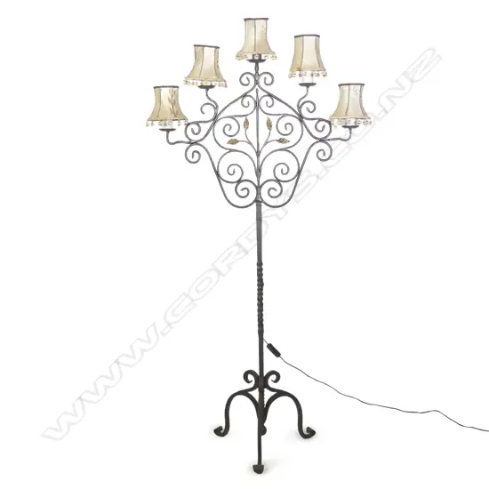 A European scrolling wrought iron floor standing lamp