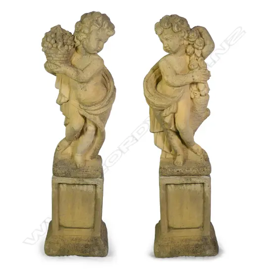 A pair of Church Stone garden statues on plinths
